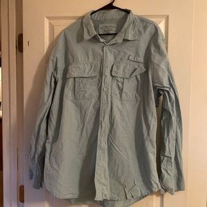 Clearwater Outfitters light blue fishing shirt.